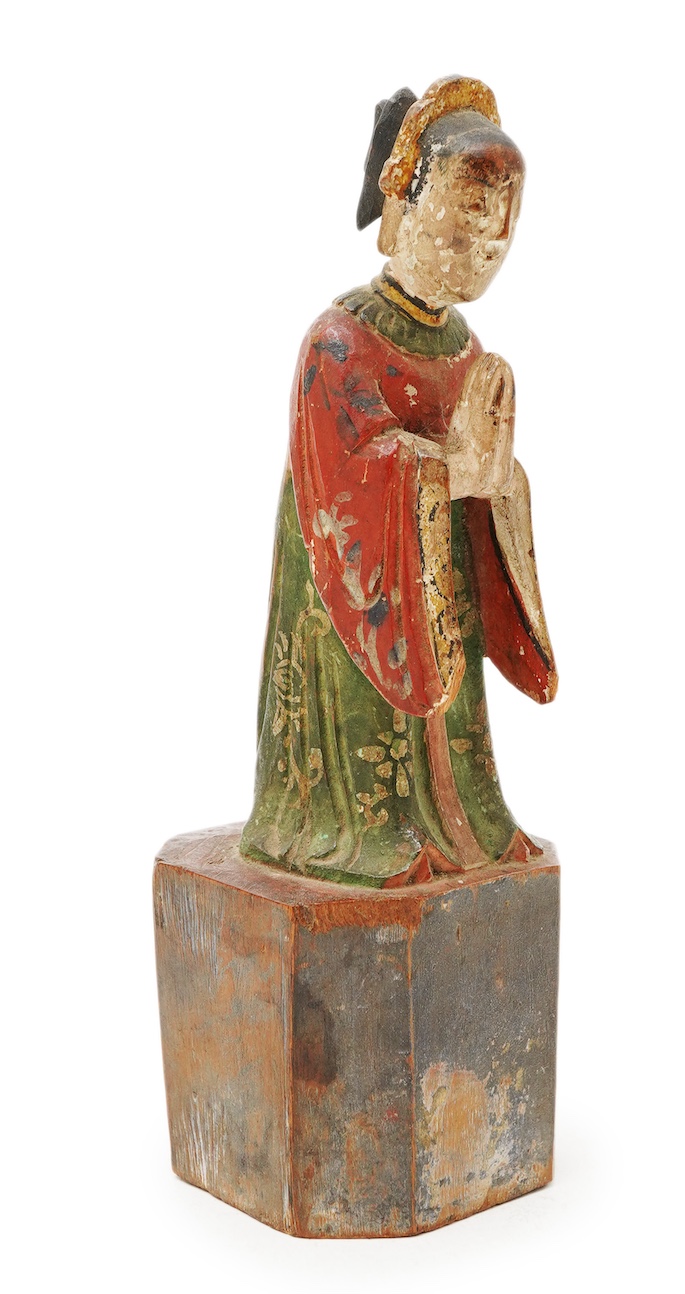A Chinese polychrome wood figure of a female attendant, Qing dynasty